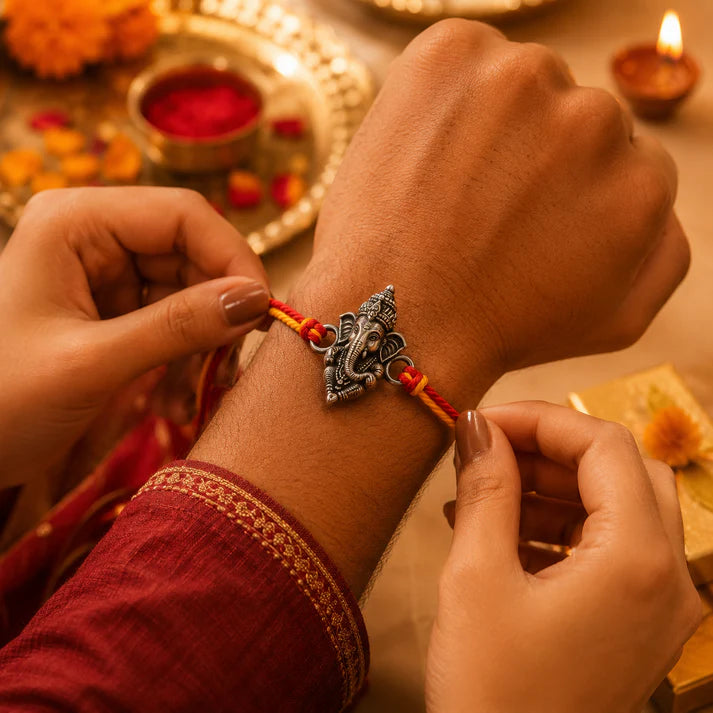 Vighnaharta Ganesha Rakhi – Silver-Tone Ganpati Charm