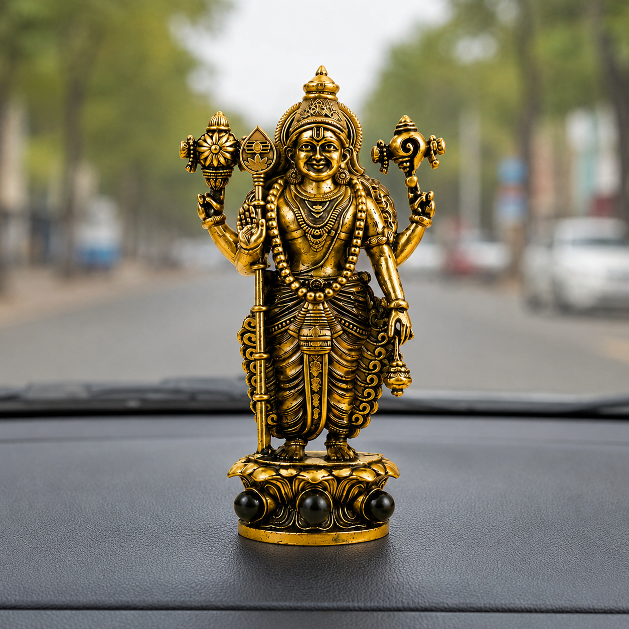 Gold Plated Lord Murugan Idol with Karungali Beads car dashboard view