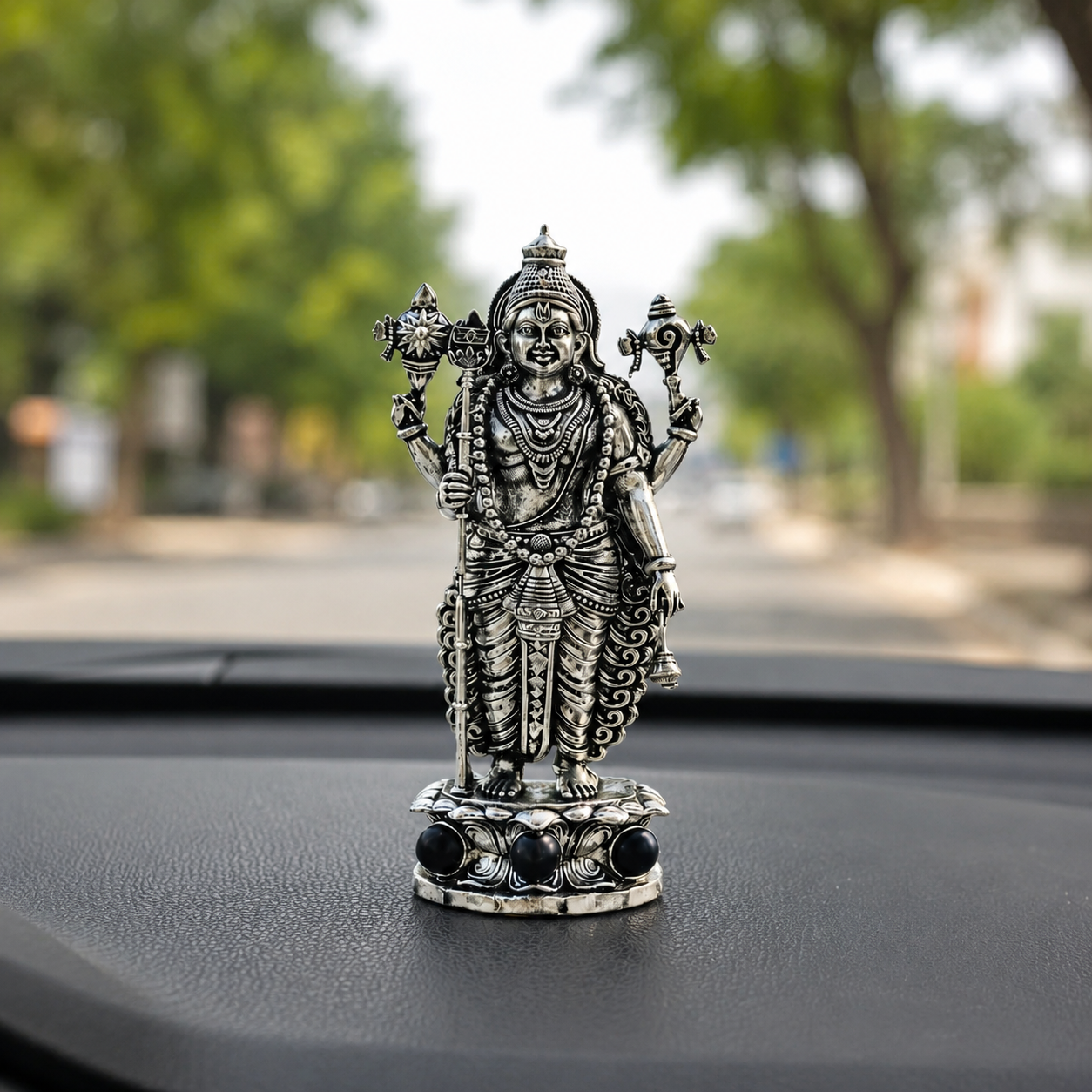 Silver Plated Lord Murugan Idol with Karungali Beads car dashboard view
